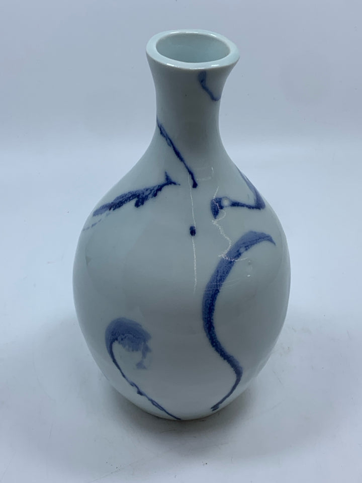 WHITE POTTERY VASE W/BLUE DESIGNS.