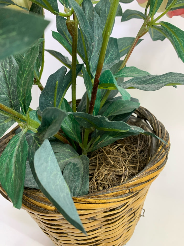FAUX PINK FLOWER BOUQUET IN WOVEN BASKET.
