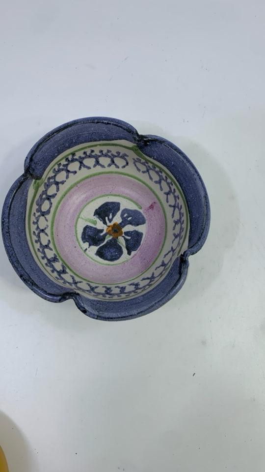 SMALL POTTERY BOWL W/BLUE FLOWERS.