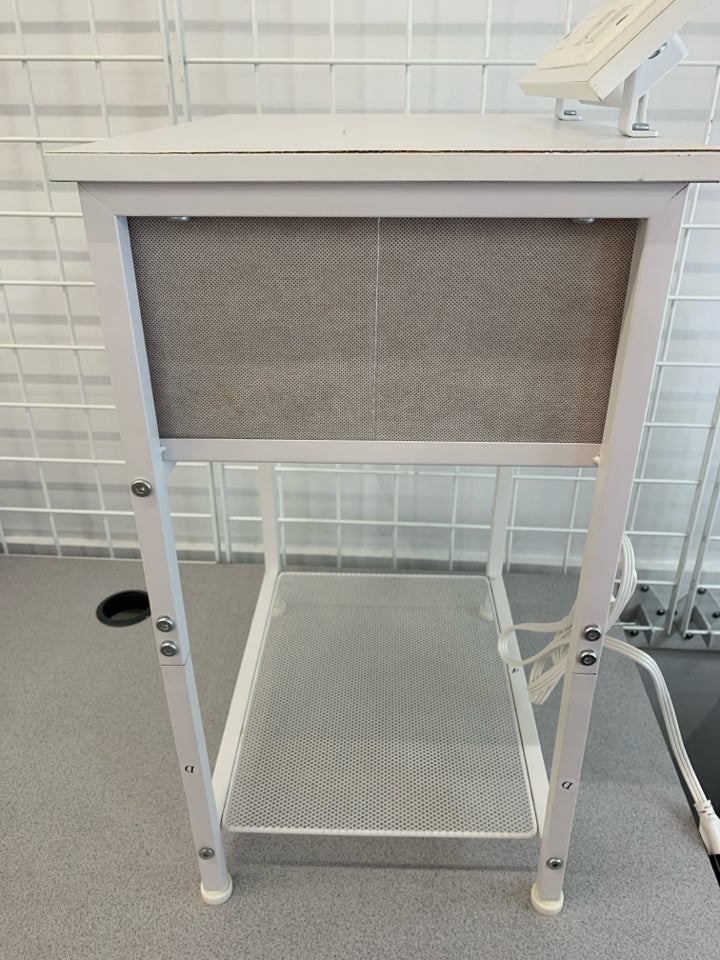 WHITE METAL FRAME NIGHTSTAND W/FABRIC DRAWER POWER OUTLET.