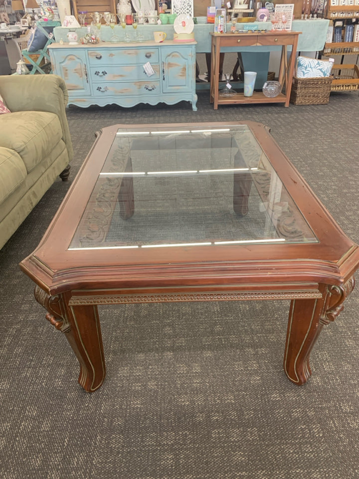 SQUARE SCROLL GLASS TOP COFFEE TABLE.