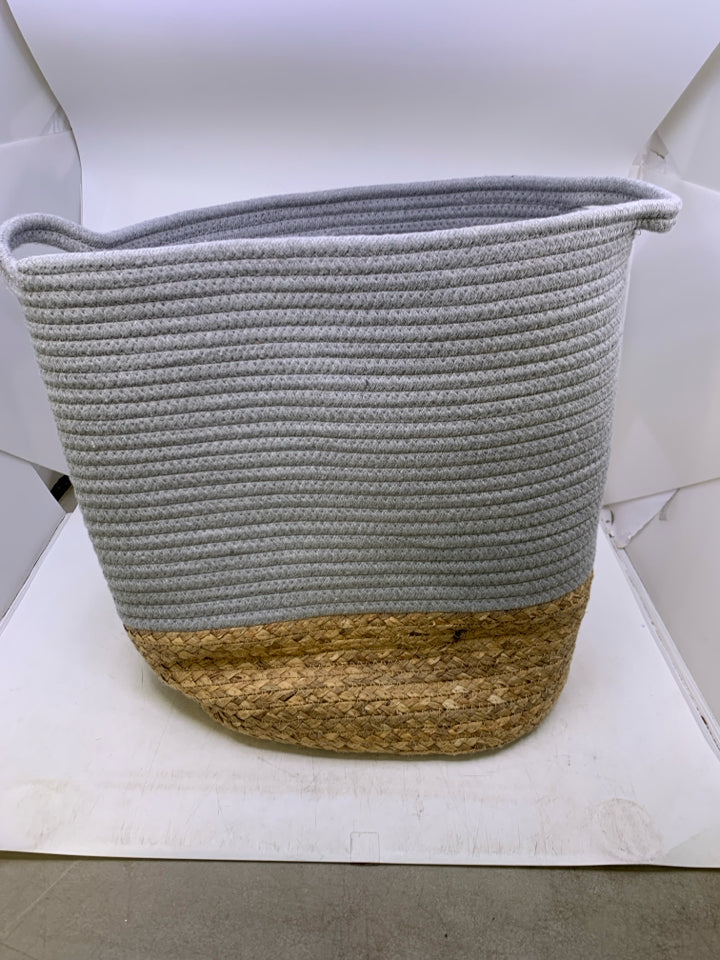 GREY WOVEN LAUNDRY BASKET W/ BURLAP BOTTOM/ HANDLES.