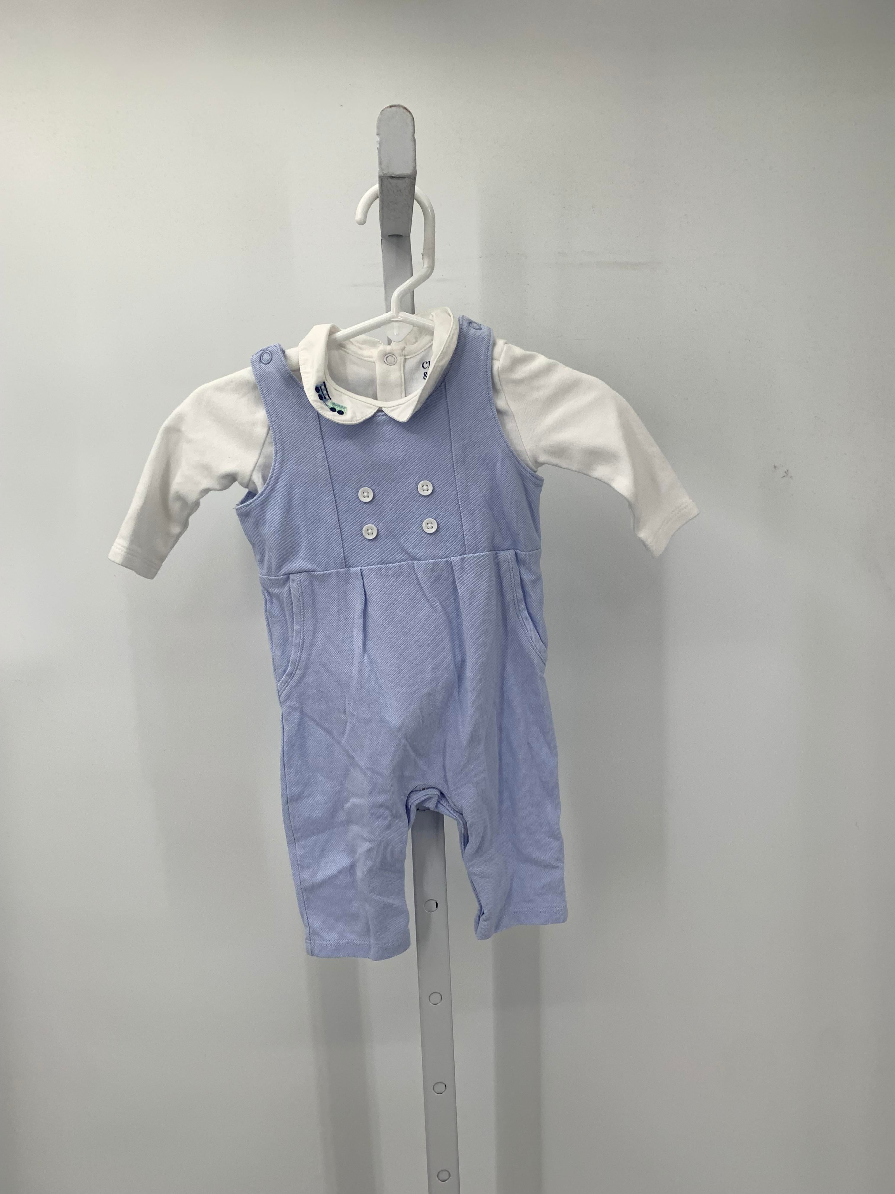 LONG SLV SHIRT AND BLUE OVERALLS.