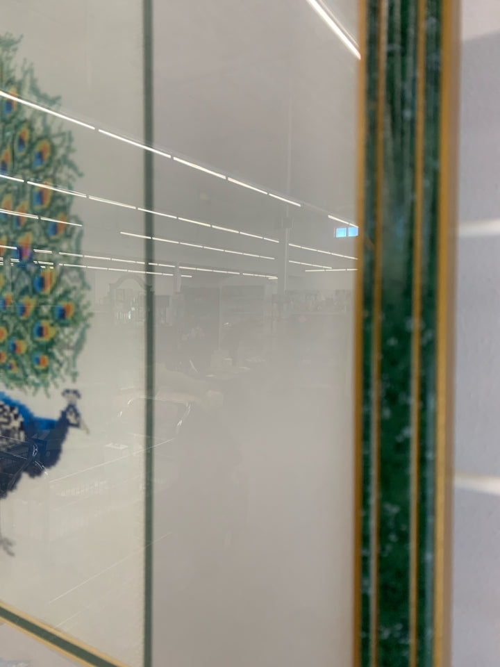 PEACOCK CROSS-STITCHED FRAMED ARTWORK.