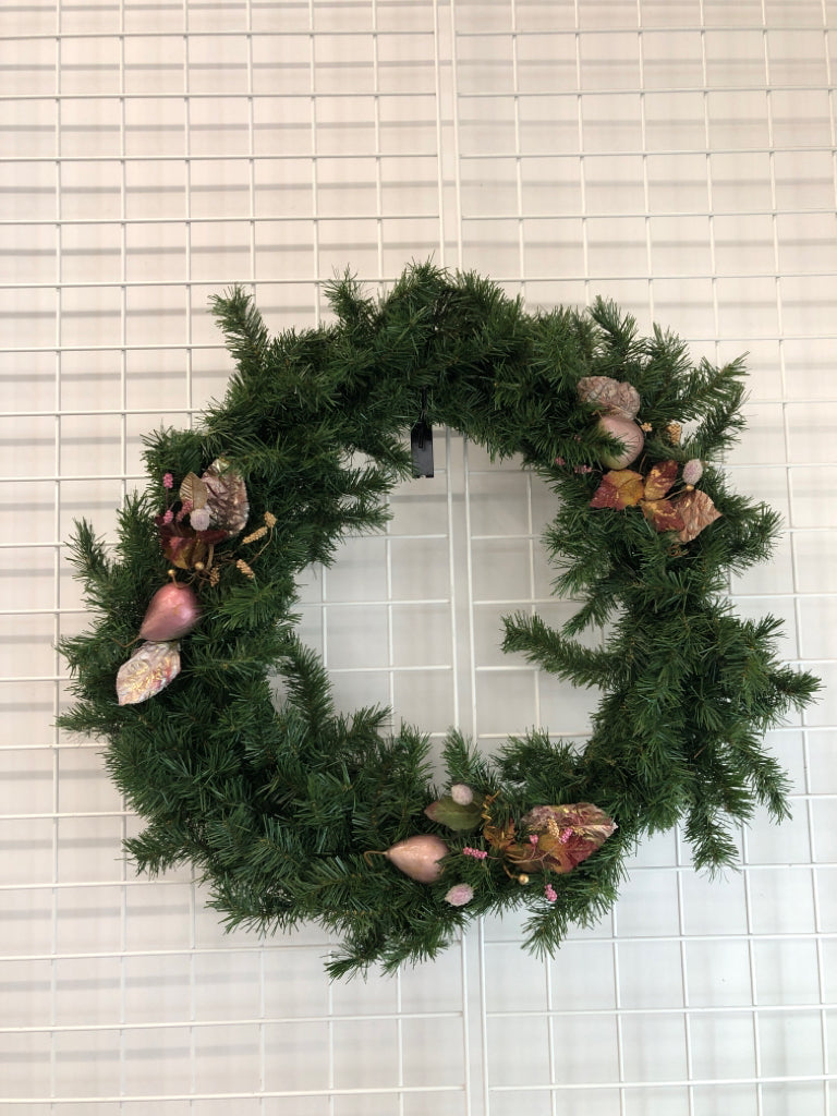 EVERGREEN WREATH W/PINK LEAVES.