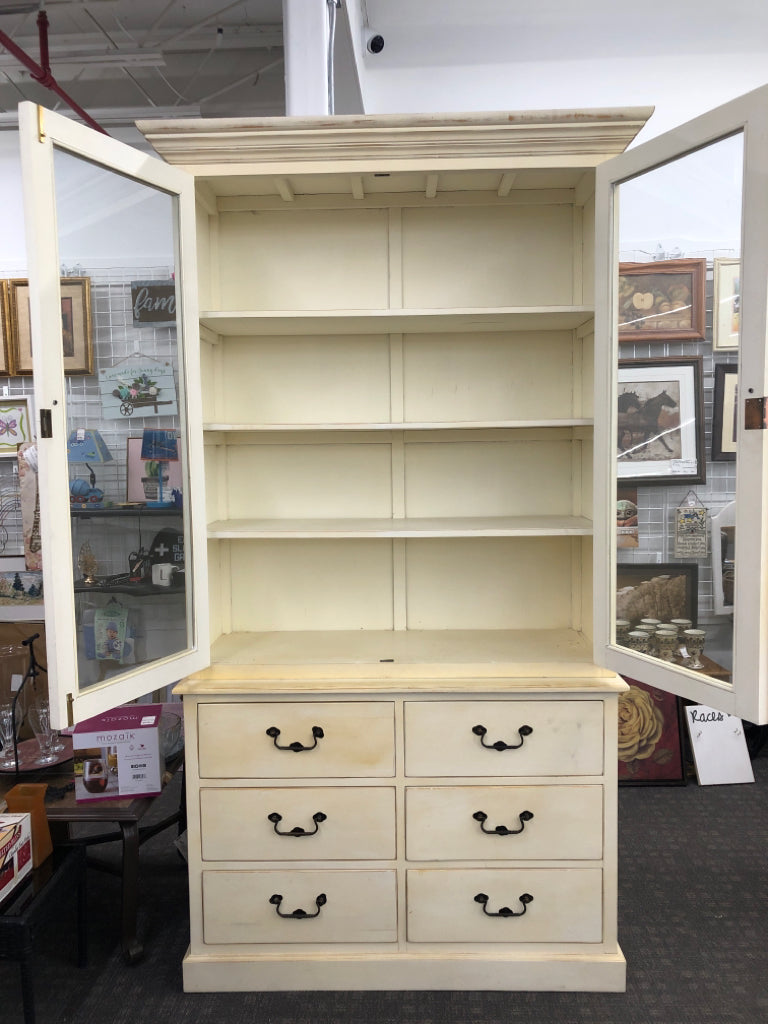 LARGE YELLOW/CREAM 2PC HUTCH 6 DRAWER 4 SHELF W GLASS DOORS AND BLACK HARDWARE.