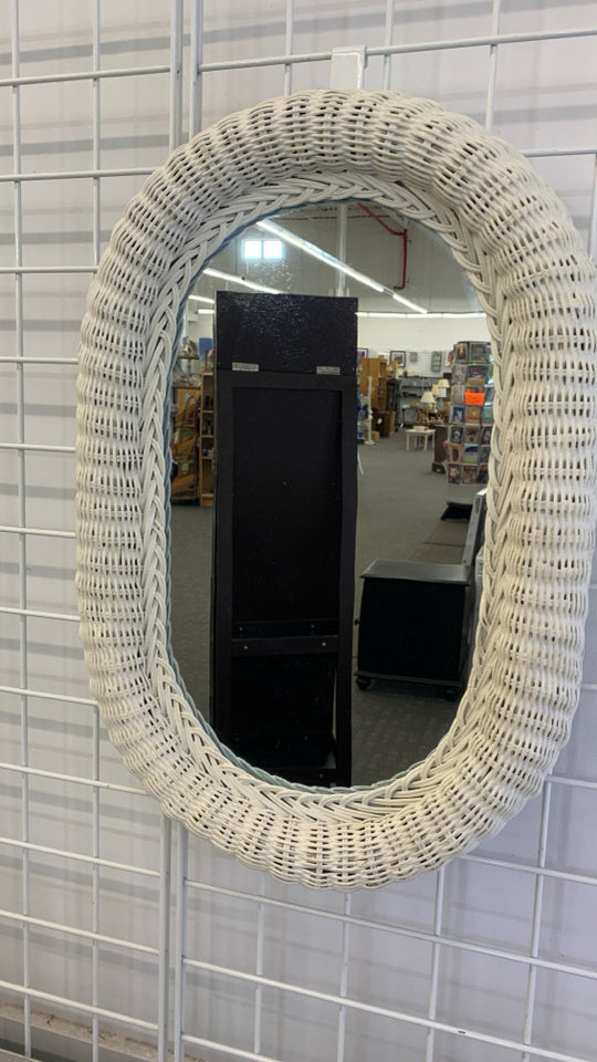 WHITE WICKER OVAL WALL MIRROR.