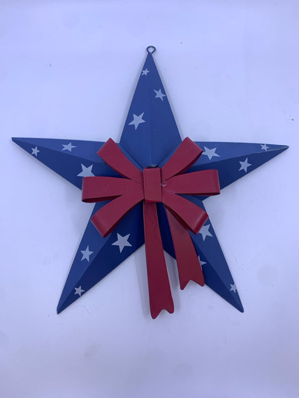 BLUE AND WHITE METAL STAR W/ RED BOW WALL HANGING.