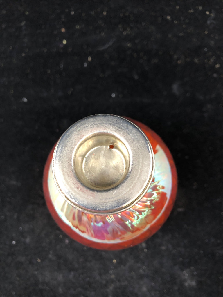 ORANGE GLASS TAPER CANDLE HOLDER.