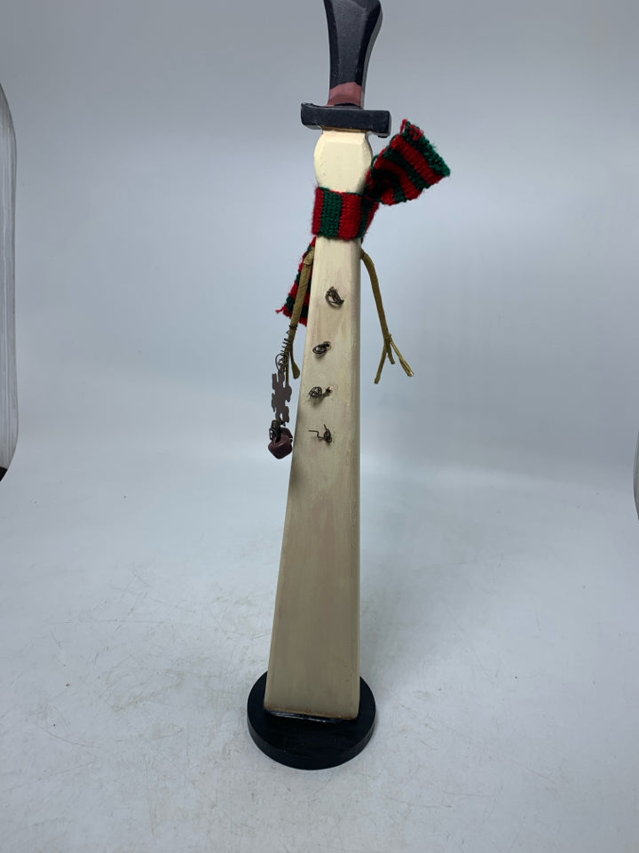 SKINNY PRIMITIVE STYLE WOOD SNOWMAN W/ BELL BUTTONS.