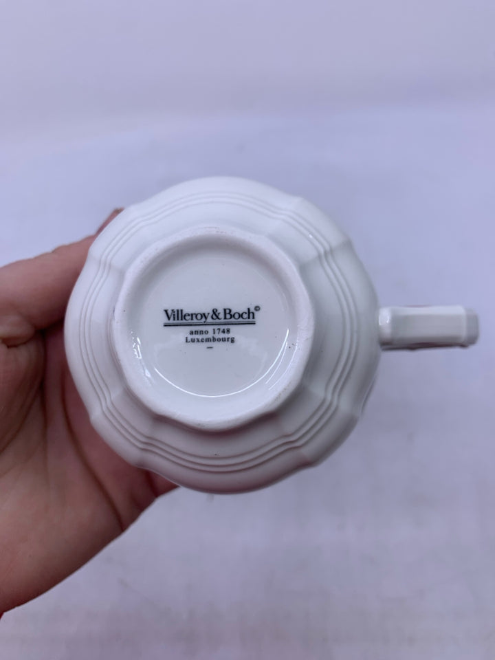 WHITE W/ ASSORTED FLOWERS RED RIM.