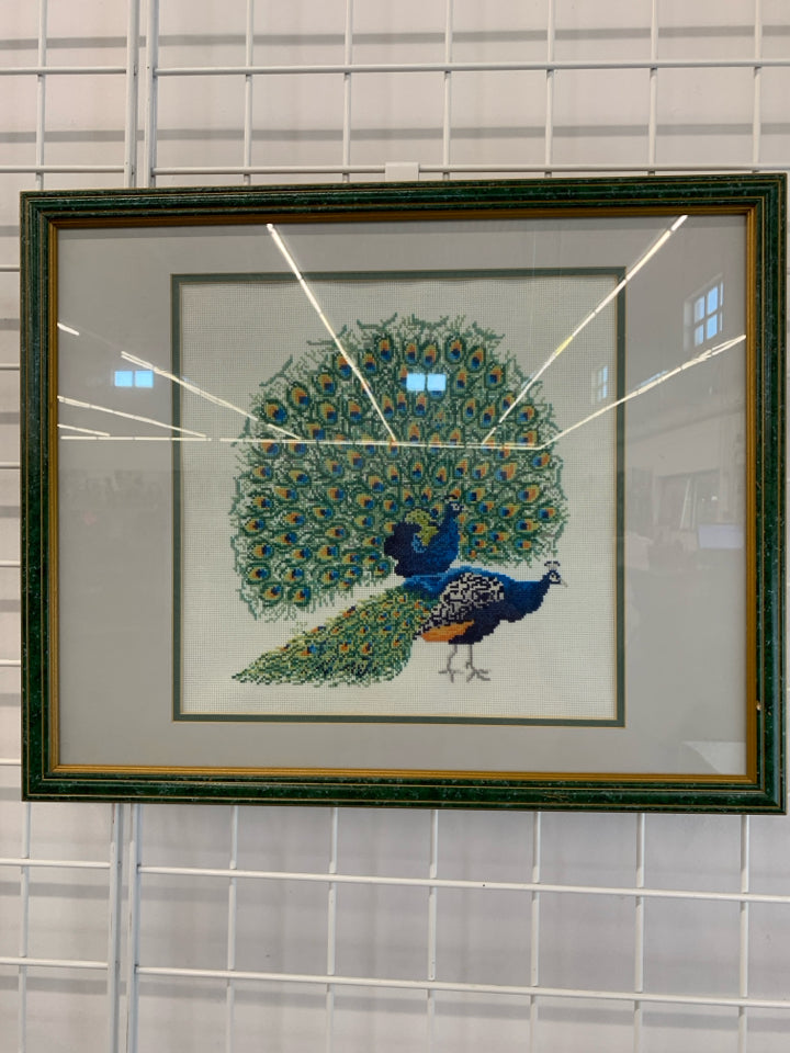 PEACOCK CROSS-STITCHED FRAMED ARTWORK.