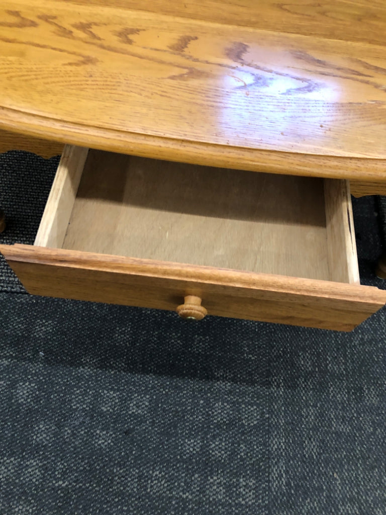 OVAL OAK WOOD COFFEE TABLE.