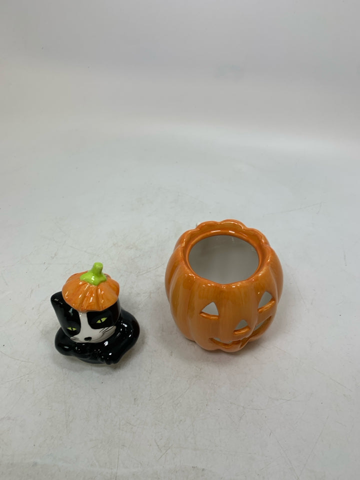 BLACK/WHITE CAT POPPING OUT OF JACKO LANTERN TEALIGHT HOLDER.