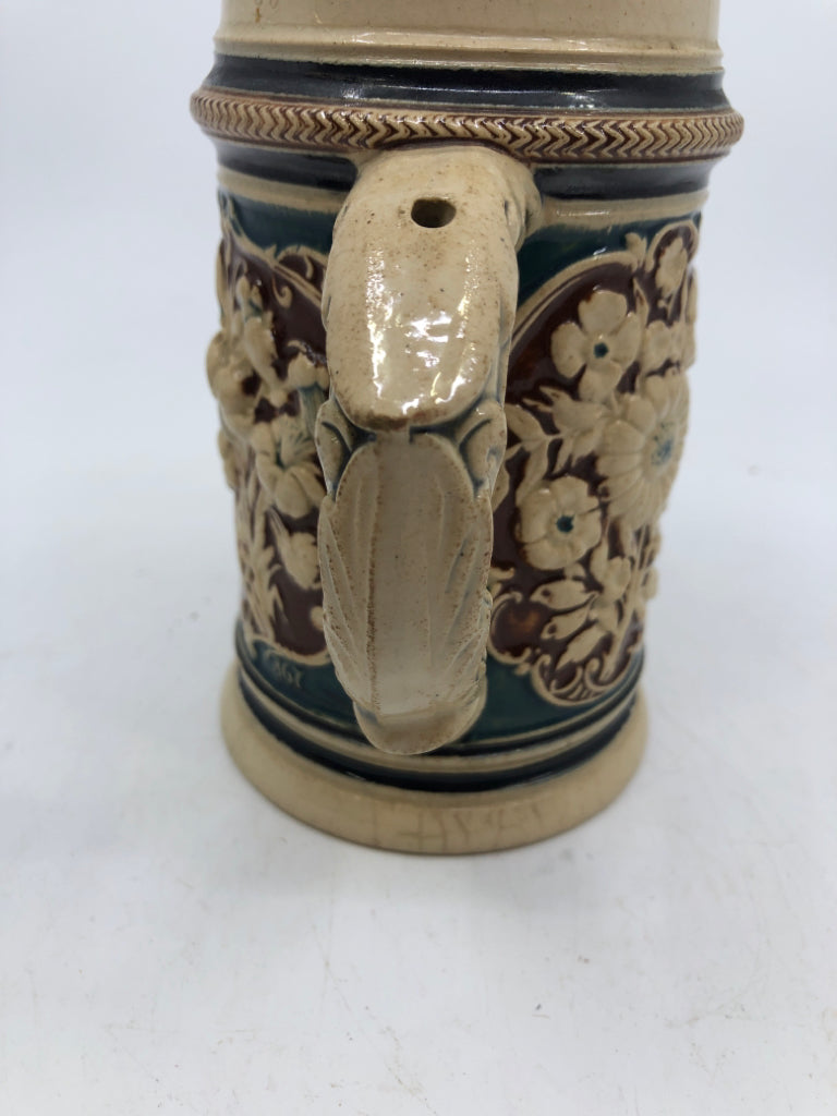 VTG EMBOSSED BOY AND GIRL DANCING STEIN.