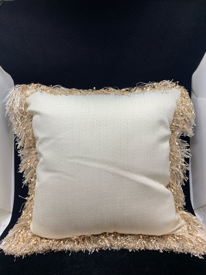 CREAM PILLOW W/TAN TASSEL FRINGE.