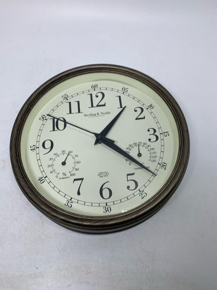 PLASTIC CLOCK W/ TEMP & HUMIDITY.