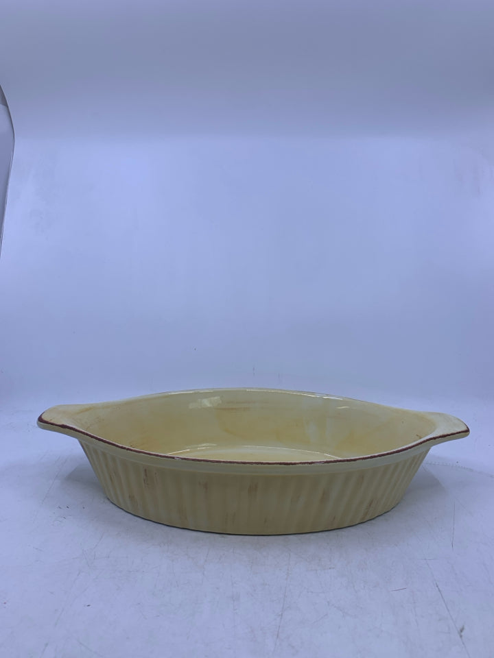 OVAL LIGHT YELLOW CERAMIC BAKER W/ HANDLES.