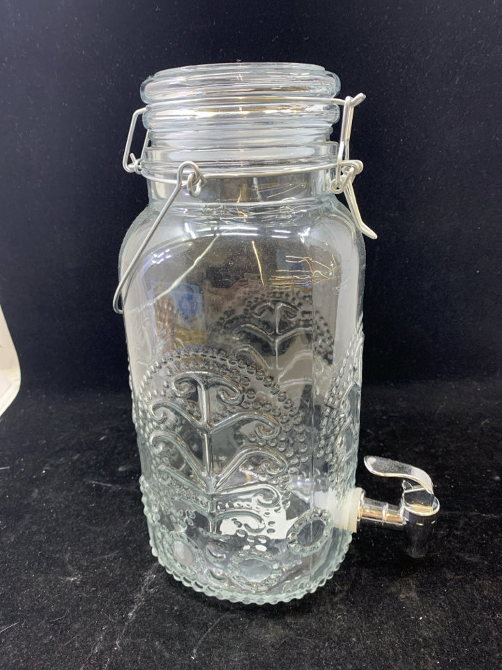EMBOSSED CLEAR GLASS DRINK DISPENSER.