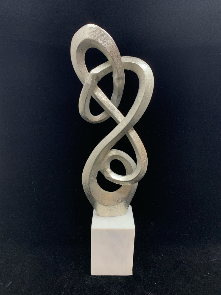 ABSTRACT METAL SCULPTURE ON MARBLE BASE.