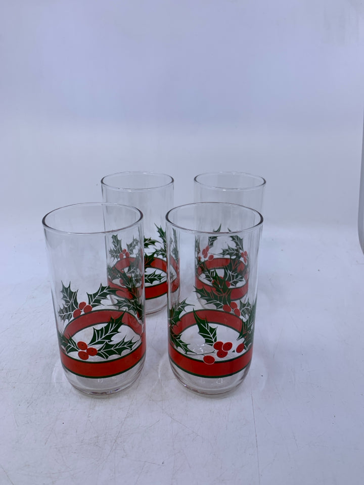 4 CLEAR GLASSES W/ MISTLETOE PRINTED ON BOTTOM.