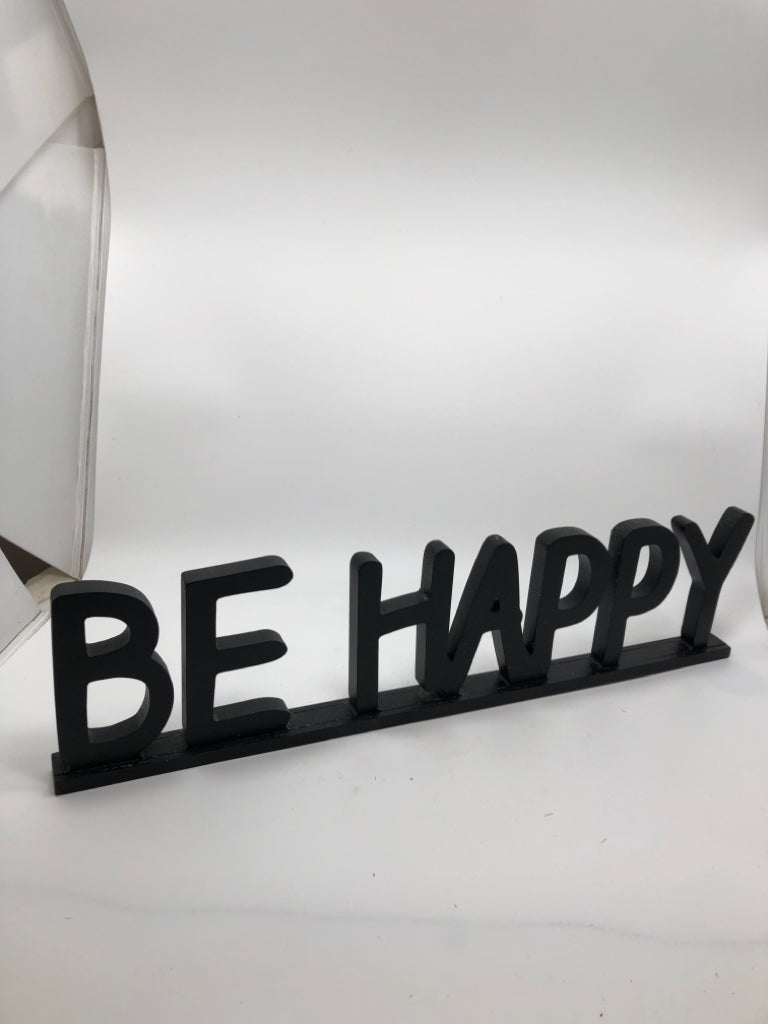 BE HAPPY BLACK WOOD SHELF SIGN.