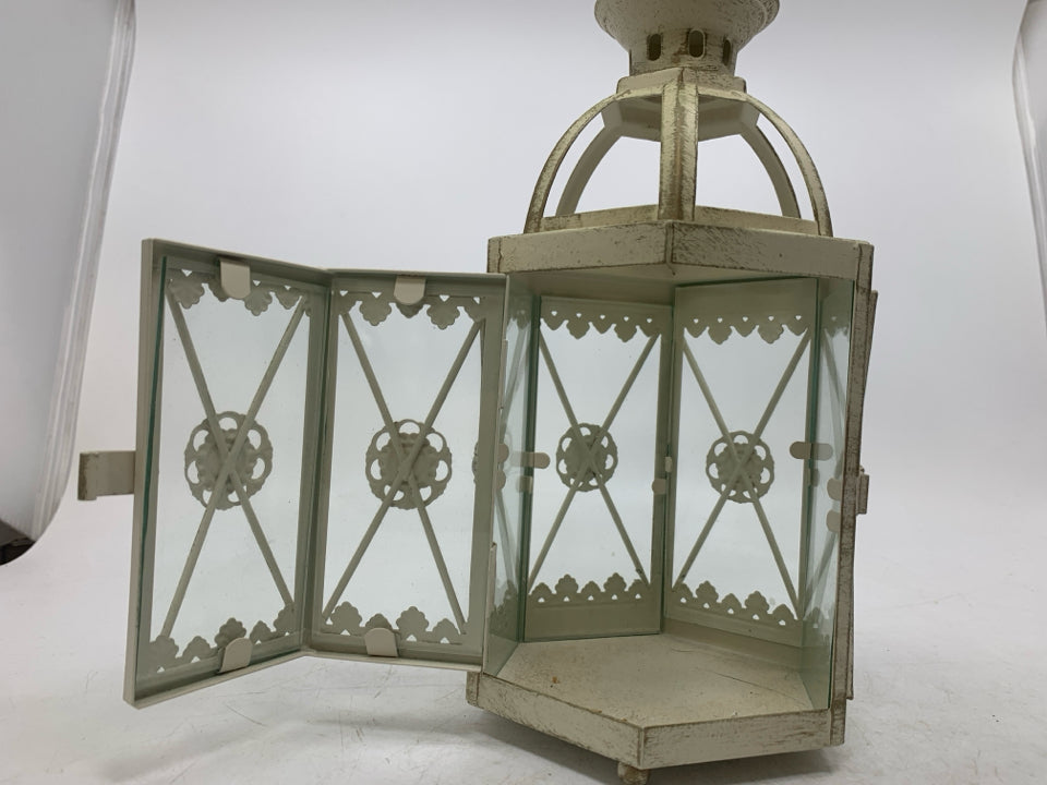 DISTRESSED CANDLE LANTERN.