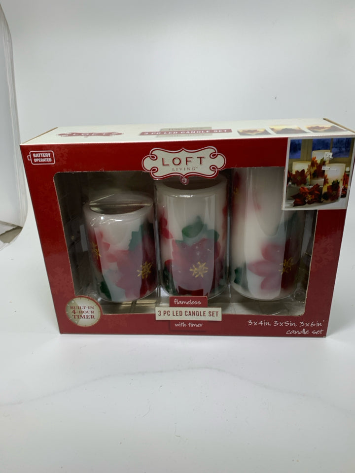 IN BOX 3 POINSETTIA LET CANDLE SET.