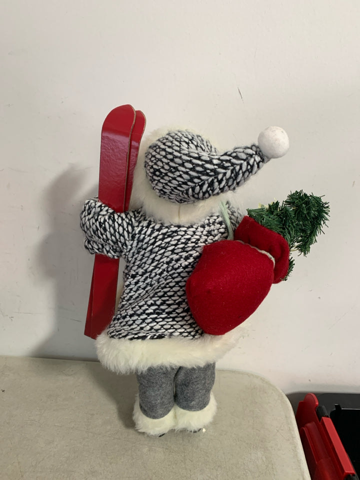 STANDING SANTA W/ SKIS BLACK/WHITE KNIT SUIT.