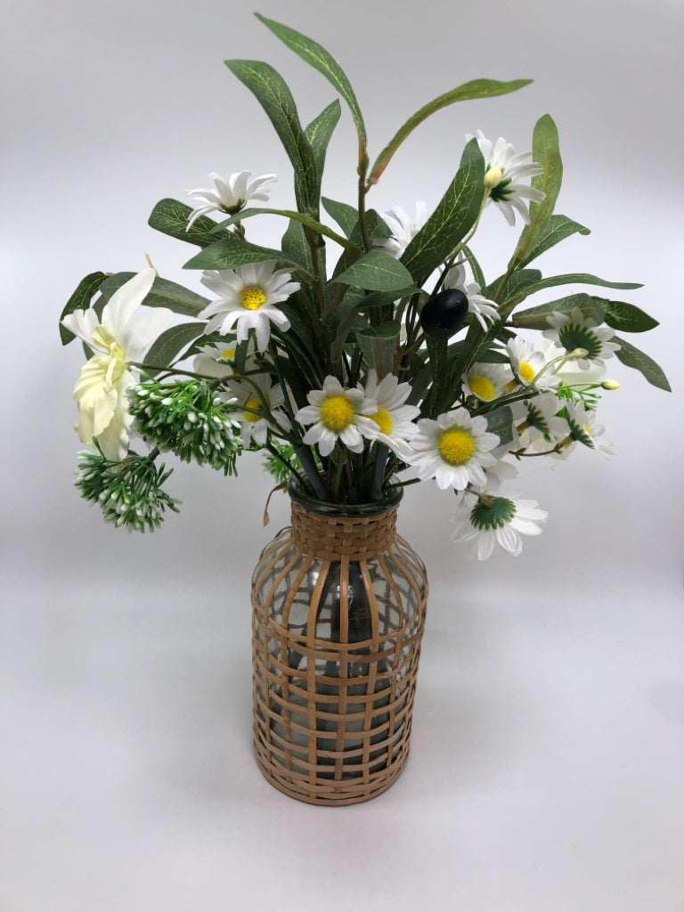 WHITE FLORALS IN COVERED WEAVE GLASS VASE.