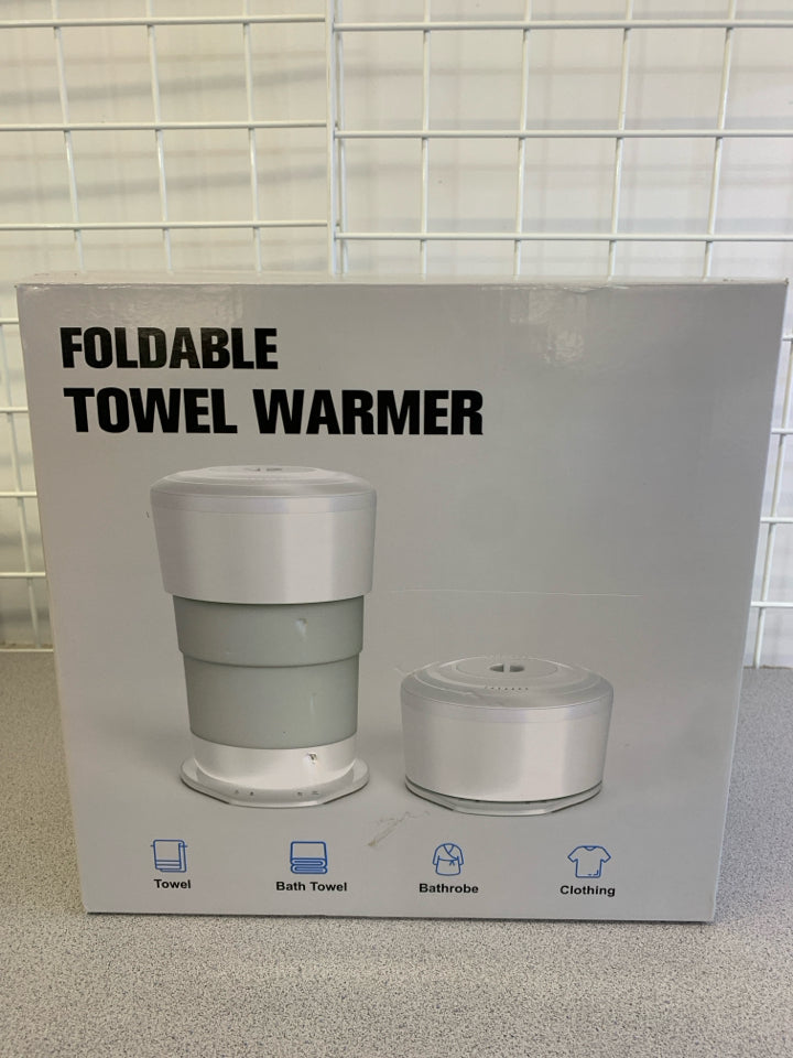 NIB FOLDABLE TOWEL WARMER.