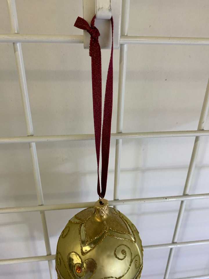 GOLD PINECONE GLASS ORNAMENT.