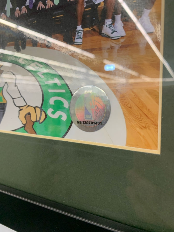 CELTICS TEAM PHOTO IN BLACK FRAME.