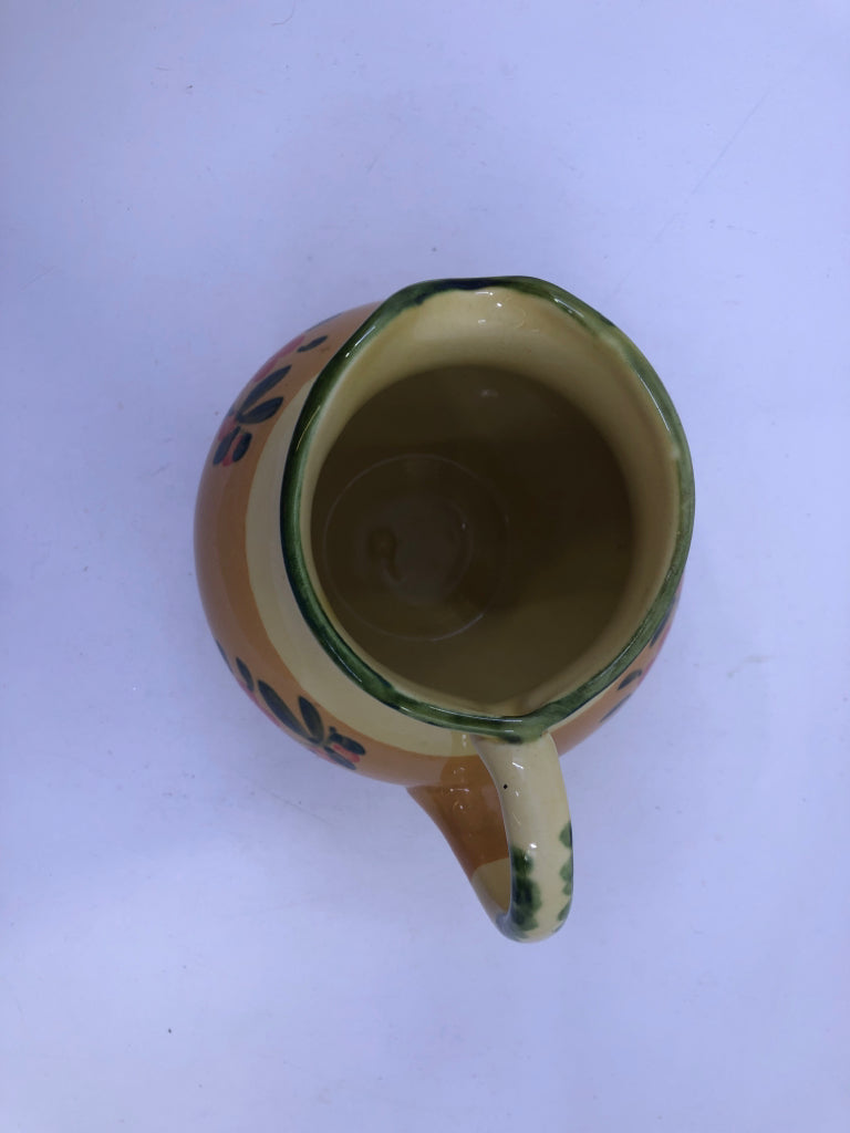 ORANGE FLORAL PAINTED PITCHER.
