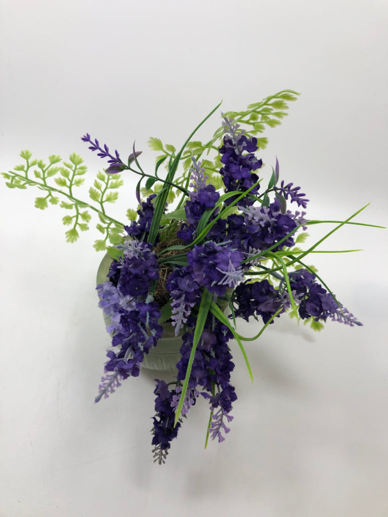 PURPLE FLOWERS IN GREEN POT.