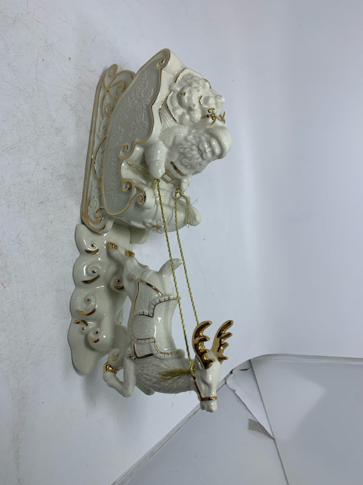 MIKASA IVORY SANTA IN SLAY W/ REINDEER GOLD DETAILS.