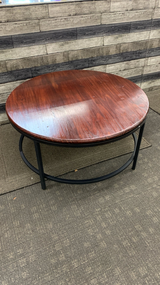 METAL BASE CHERRY WOOD CIRCLE COFFEE TABLE.