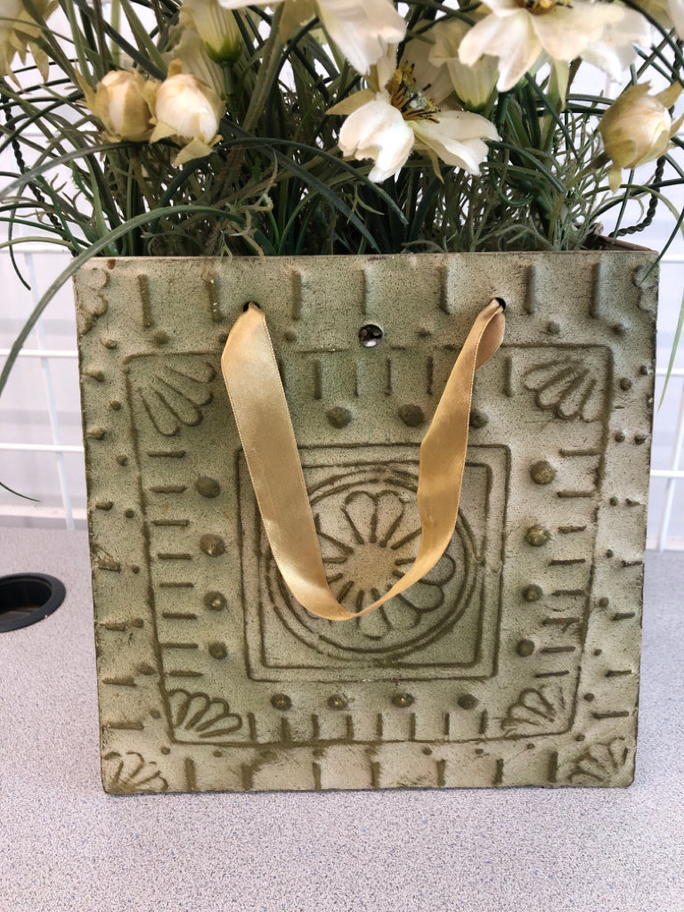 METAL BAG VASE W/WHITE FLORALS.