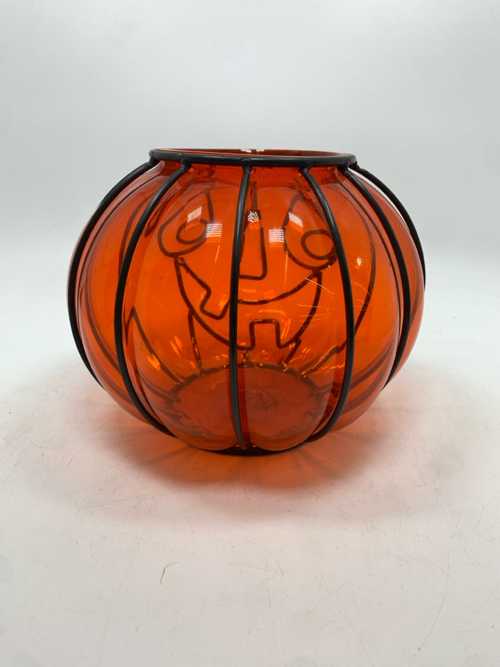 ORANGE GLASS IN BLACK PUMPKIN FACE CANDLE HOLDER.