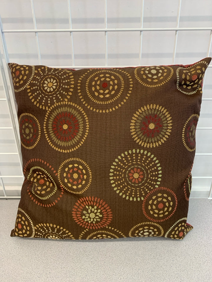 RED/BROWN CIRCLE STITCHED PILLOW.