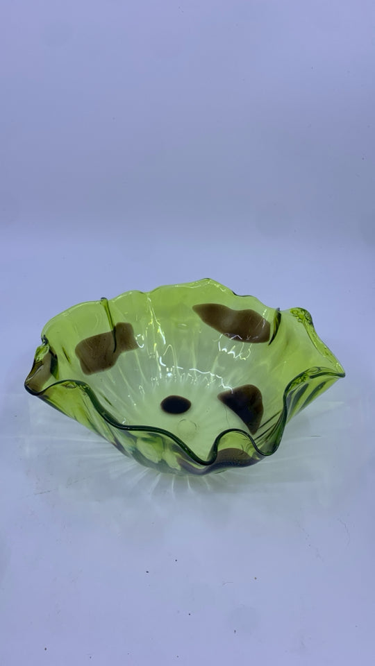 BLOWN LIGHT GREEN GLASS BOWL W/ DARK BROWN SPOTS UNEVEN EDGE.