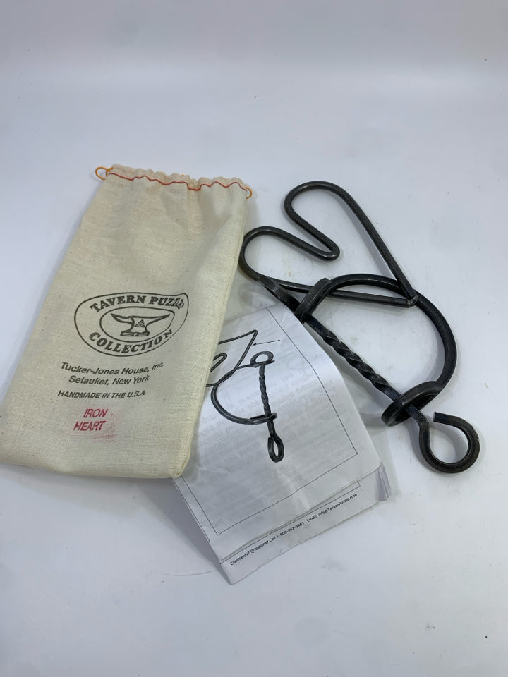 TUCKER JONES IRON HEART PUZZLE IN BAG.