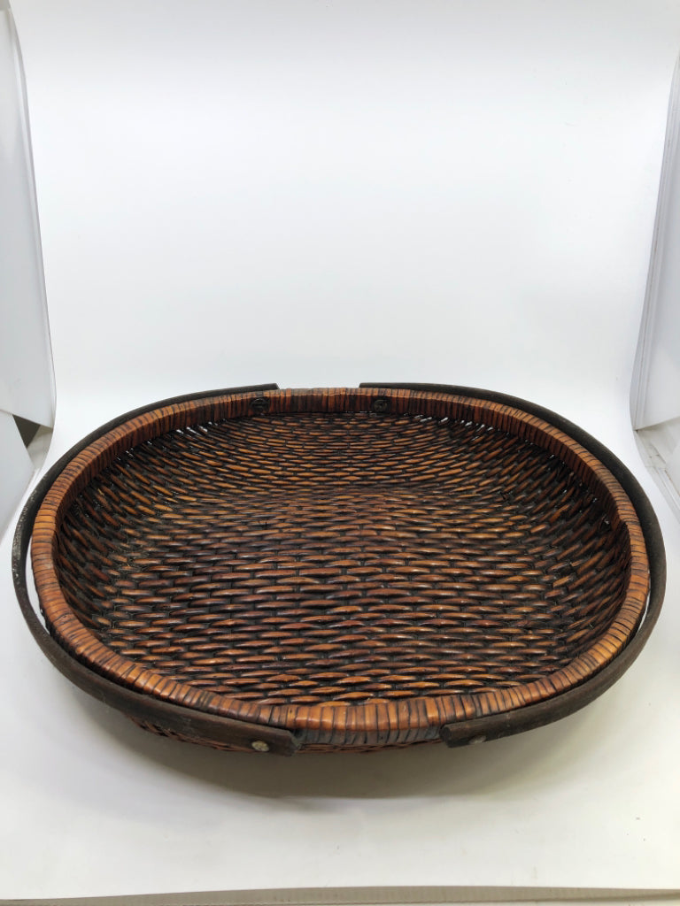DARK BROWN OVAL BASKET W/ 2 HANDLES.