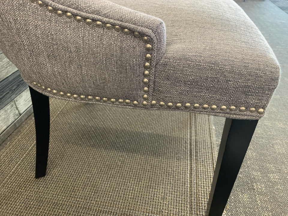 DARK GREY ACCENT CHAIR W/ BLACK LEGS STUDDED EDGE.