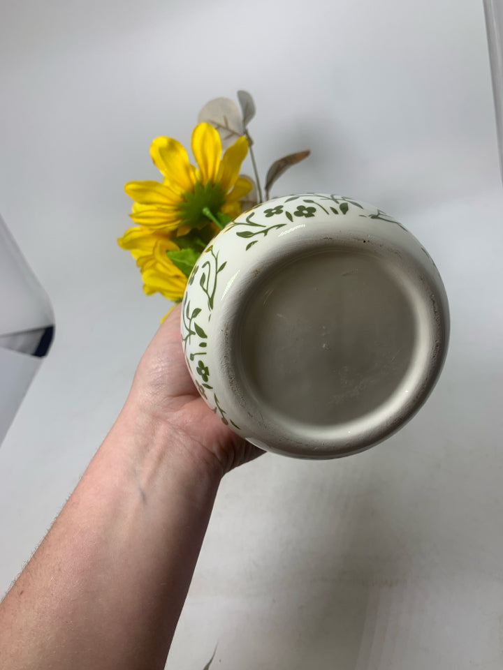 WHITE/GREEN VASE W/ FAUX YELLOW FLOWERS.