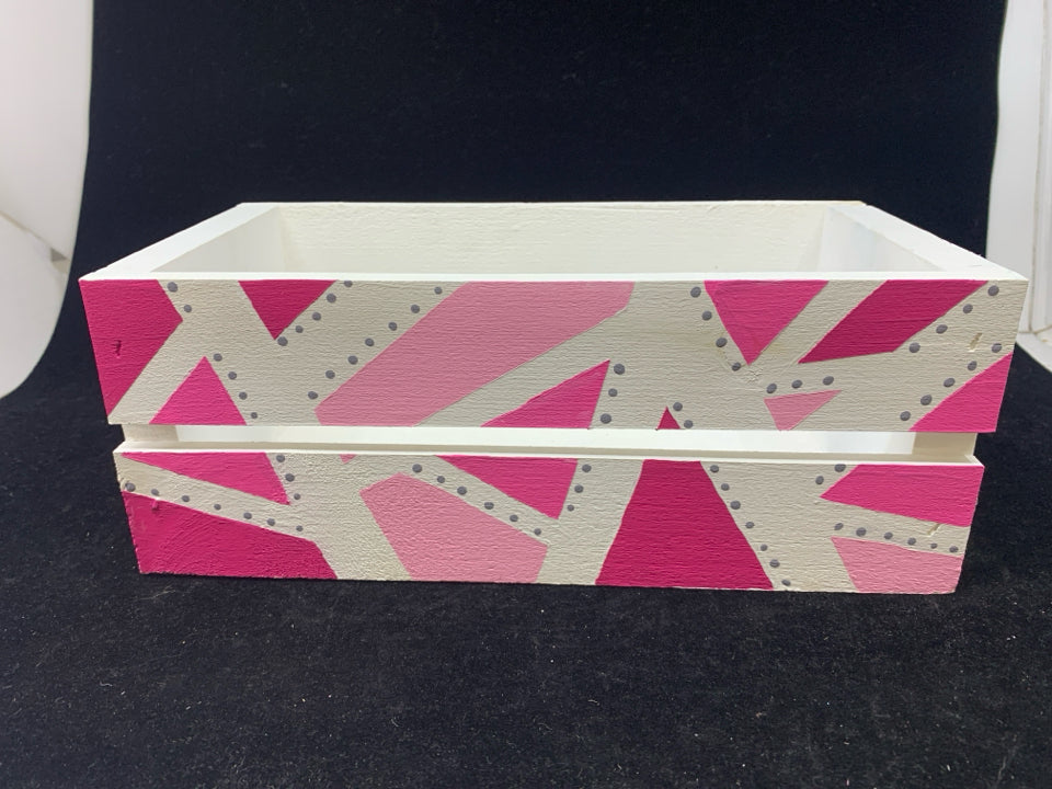 PINK AND WHITE DECORATIVE CRATE.