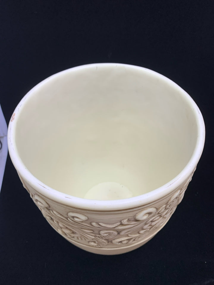 CREAM CERAMIC PLANTER W/EMBOSSED DETAILING.
