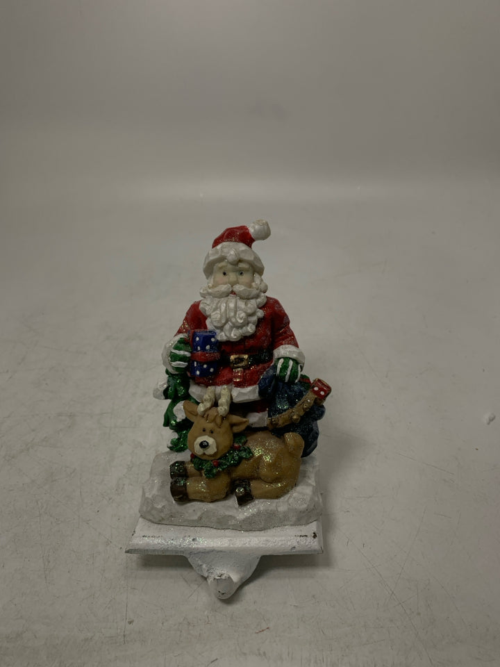 SPARKLE SANTA W/ LAYING REINDEER STOCKING HANGER.