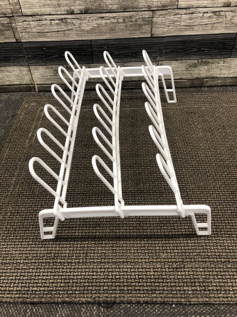 WHITE PLASTIC STANDING SHOE RACK.