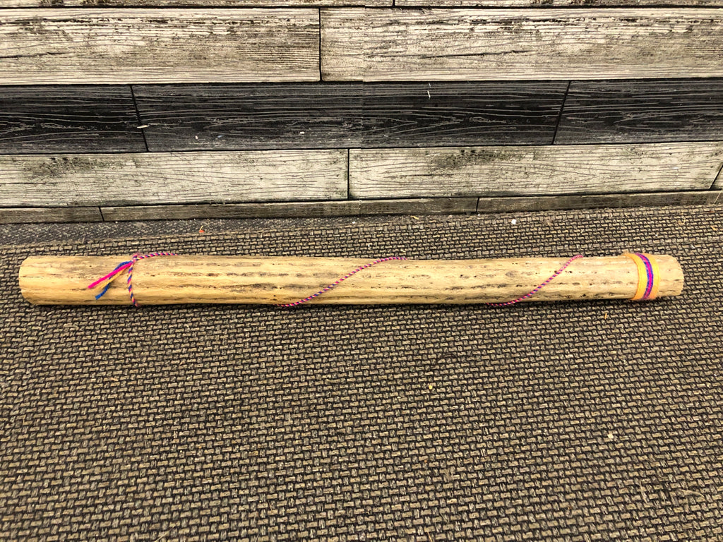YARN WRAPPED RAIN STICK.